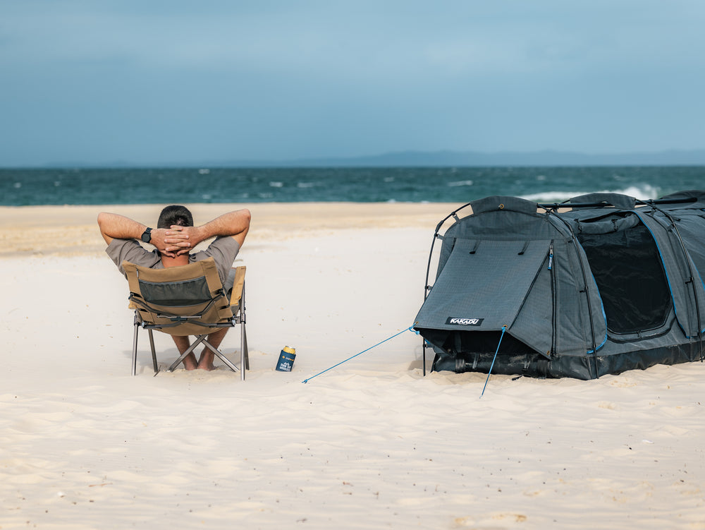 Person Relaxing On The Beach Next To The Kakadu Sundowner Swag Tent