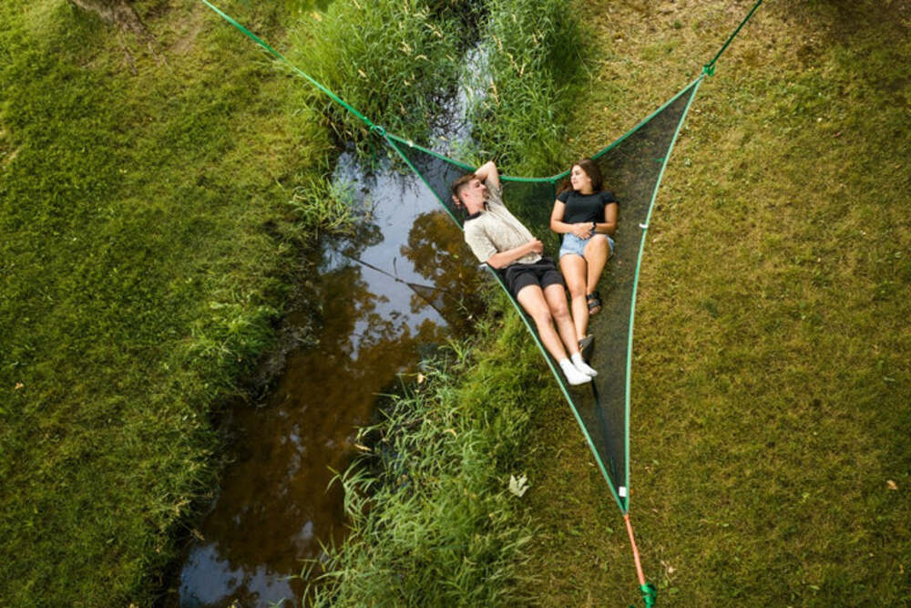 Top View Of 2 People Resting Inside The Tentsile T-Mini Green 2 Person Camping Hammock