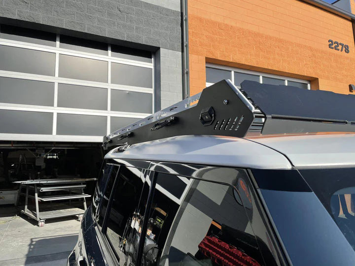 Image highlighting the stainless steel grab handle of the alpha roof rack