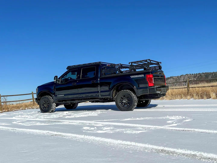 Image showing the uPtop Overland Bravo roof rack mounted on the Ford F250 side view