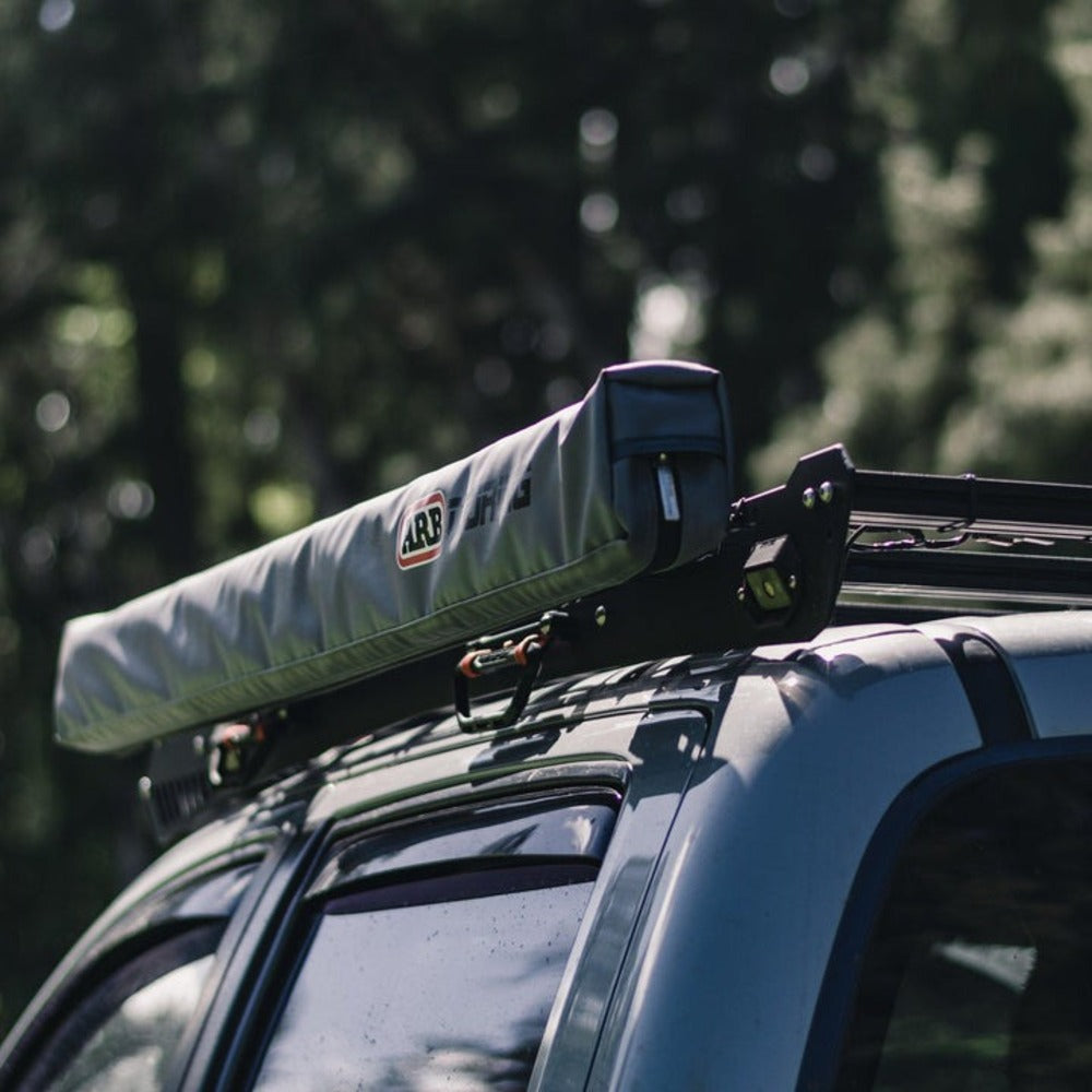 upTOP Overland ShadeBRKT Awning Bracket With An Awning Attached