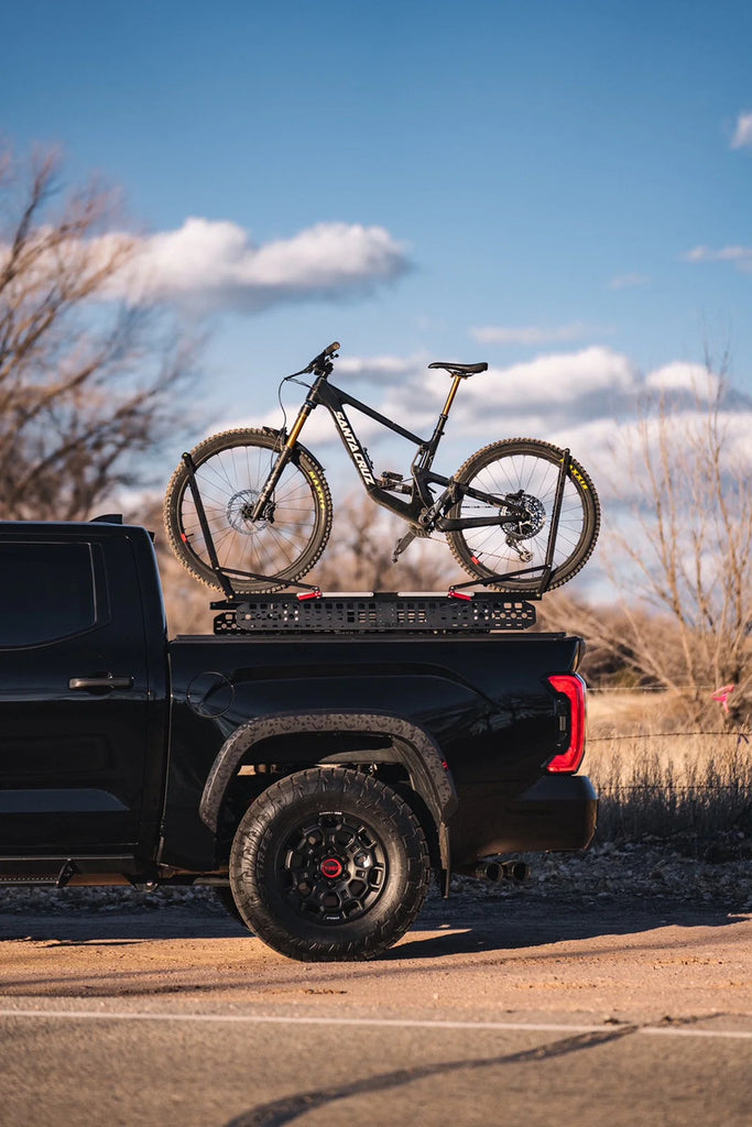Side View Of BillieBars Bed Bars For Toyota Tundra With A Mounted Bike