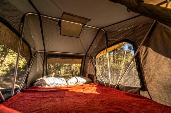 Pillow And A Blanket Inside Of The Front Runner Roof Top Tent With The Windows Down