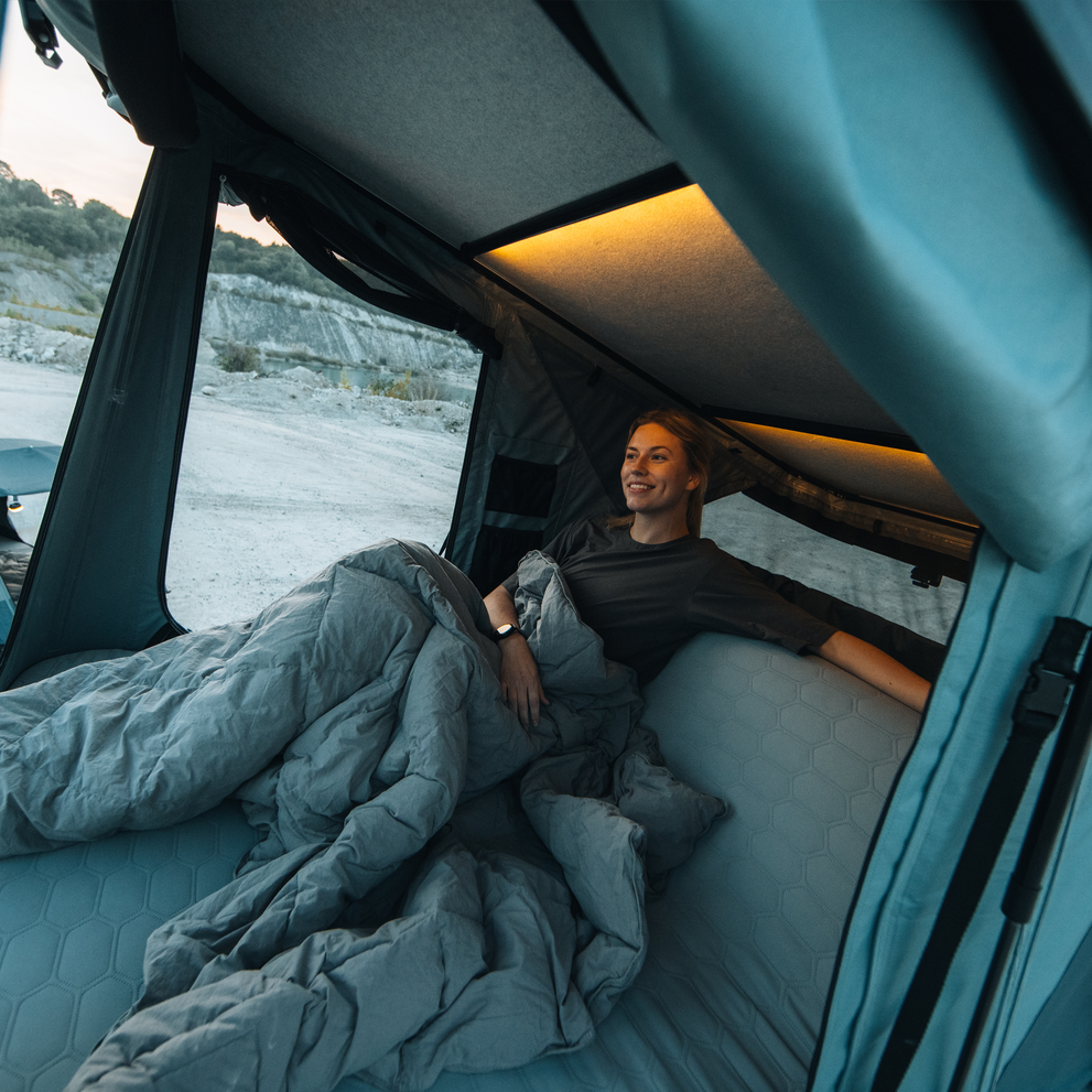 Thule Widesky built-in sofa mode with woman enjoying the view