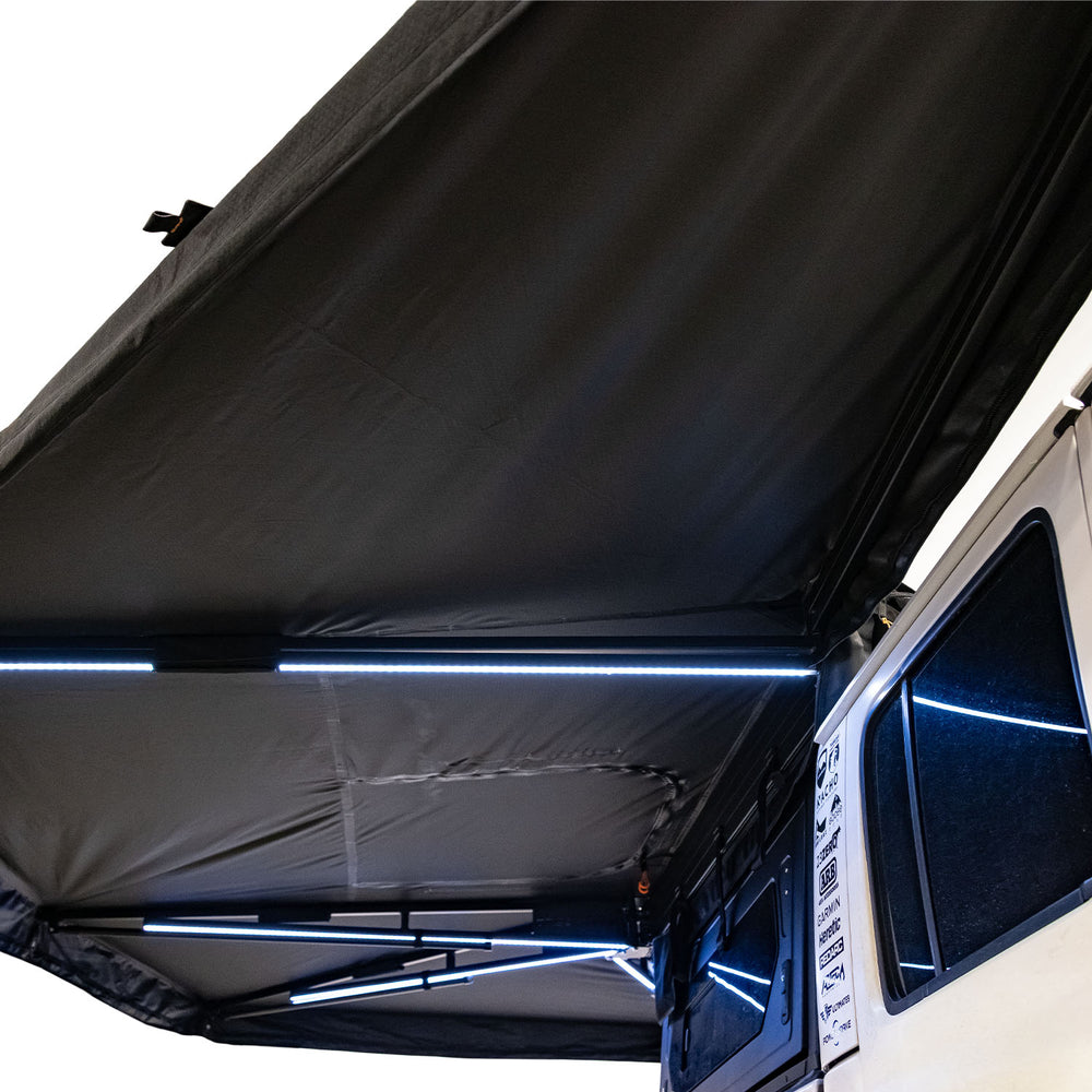 Under-awning interior view of 23Zero Onyx 270 freestanding vehicle awning