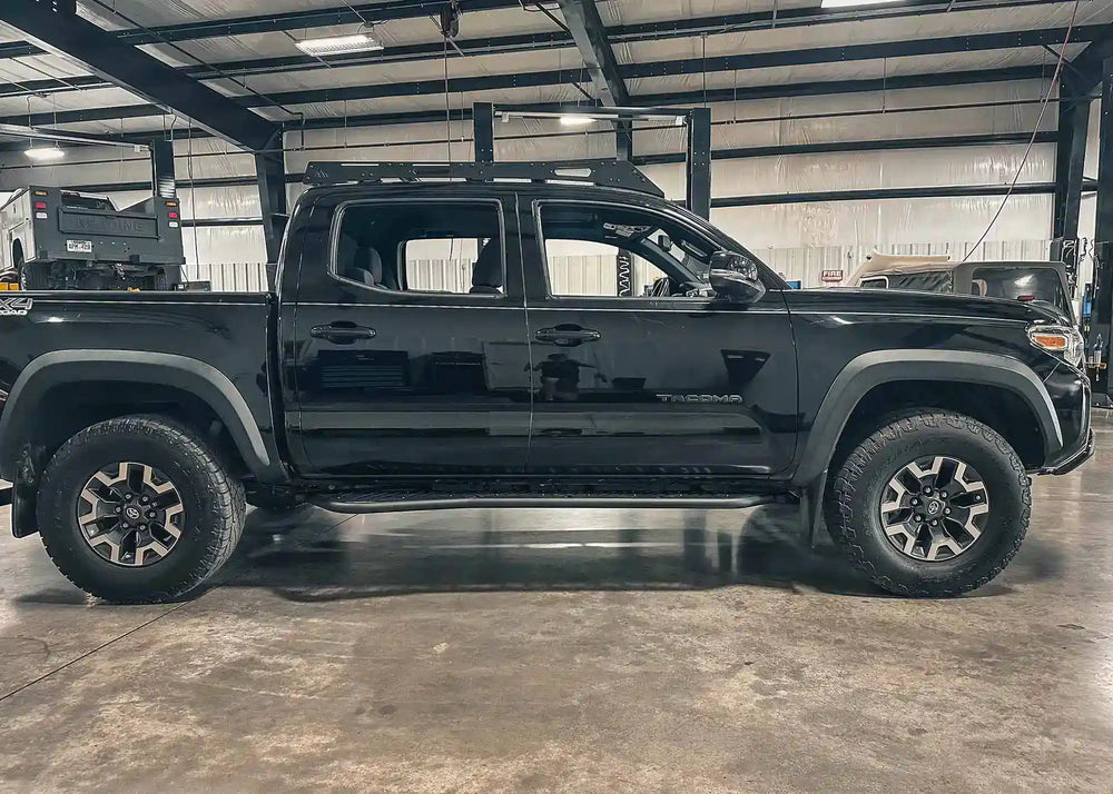 Bolt-on rock sliders installed on Tacoma
