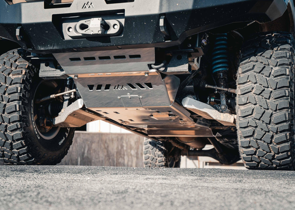 Backwoods Adventure Mods 2005-2023 2nd and 3rd Gen Toyota Tacoma Full Skid Plate Kit System in RAW Aluminum finish installed on a overland tacoma truck build