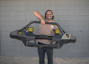 One-hand lift demonstrates 82 lb weight