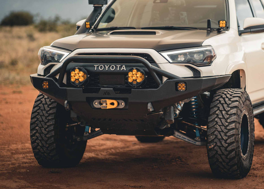Close up of off road winch mounted on the  Backwoods Adventure Mods 2010-2024 Toyota 4Runner Hi-Lite Overland Front Bumper with Prerunner Bull Bar