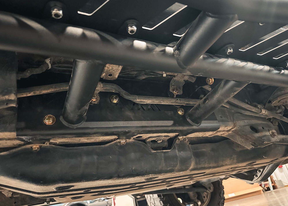 Image showing the easy bolt-on installation of the Backwoods Adventure Mods 2010-2024 5th Gen Toyota 4Runner Rock Sliders
