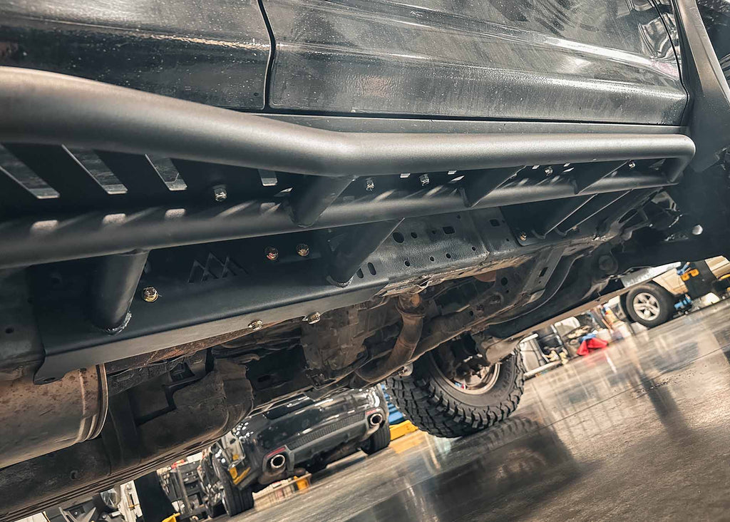 Close up of the bolt-on frame installation of the Backwoods Adventure Mods 2010-2024 5th Gen Toyota 4Runner Rock Sliders