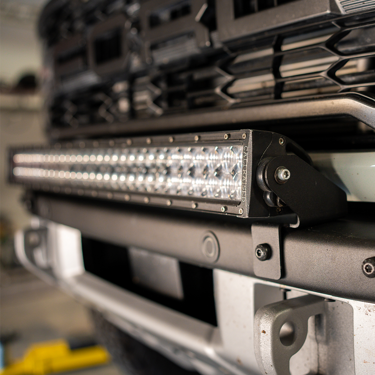Cali Raised LED bumper light bar mounting kit fitted to a Ford Bronco Raptor