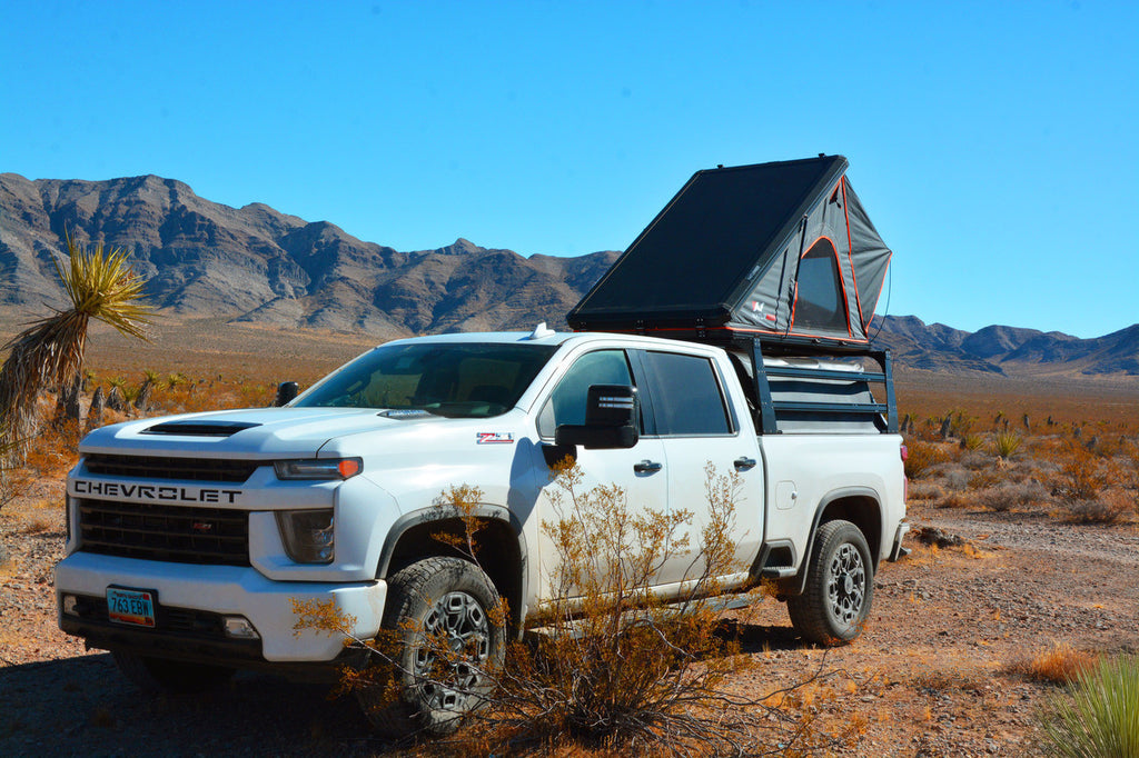 GMC with rooftop tent setup