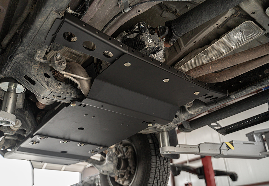 Cali Raised LED transfer case skid plate with steel crossbar for the 2016-2023 Toyota Tacoma in semi-gloss black powder coat