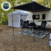 HD Nomadic 90 degree camping awning lifestyle shot at campsite