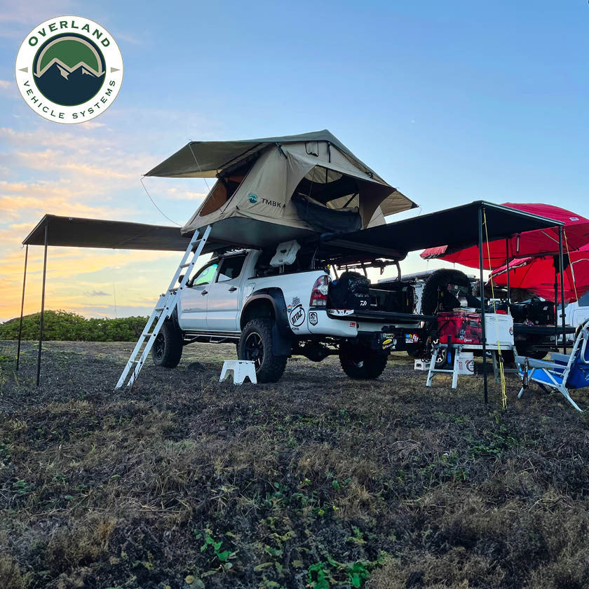OVS HD Nomadic 90 degree truck awning deployed on vehicle in field