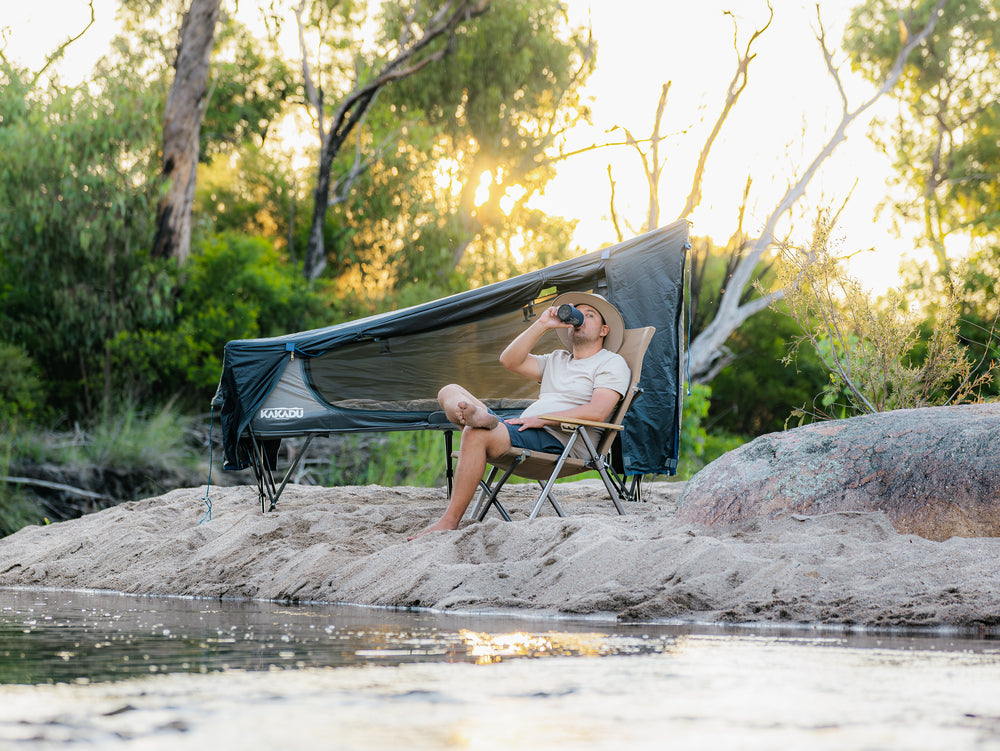 Person Relaxing By The Kakadu BlockOut Stretcher Tent