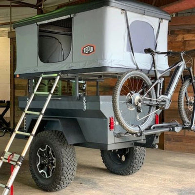 Patrol XC with Tepui tent on top and bike