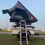 Patrol XC with black clamshell rooftop tent