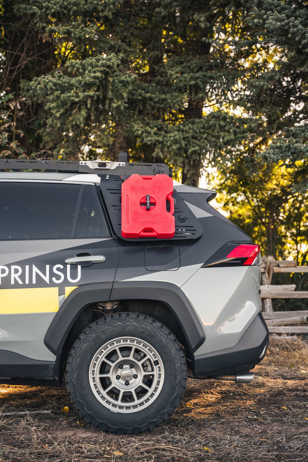 Rear Window Accessory Panel Mounted On Toyota Rav4 5th Gen With a case mounted on it