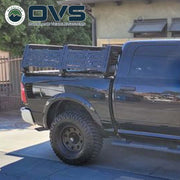 Ruff Rax 2009-2018 RAM 1500 5.7 ft bed rack side view showing adjustable crossbar layout and dual-stage black powder coat