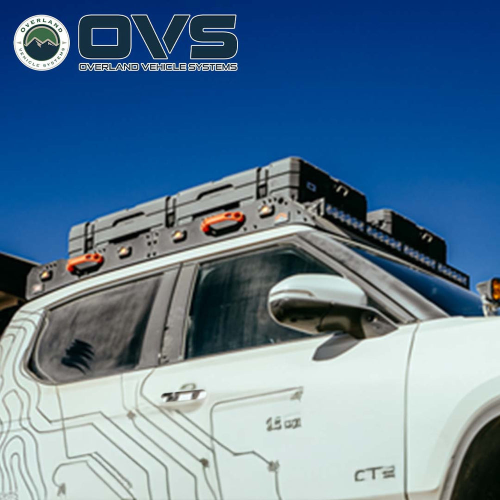 Ruff Rax Rivian R1T roof rack low-angle view showing dual-stage black powder coat finish