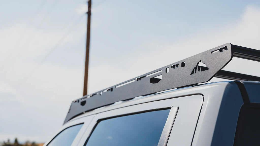 Side view of the grizzly roof rack mounted on a toyota tundra parked on the road