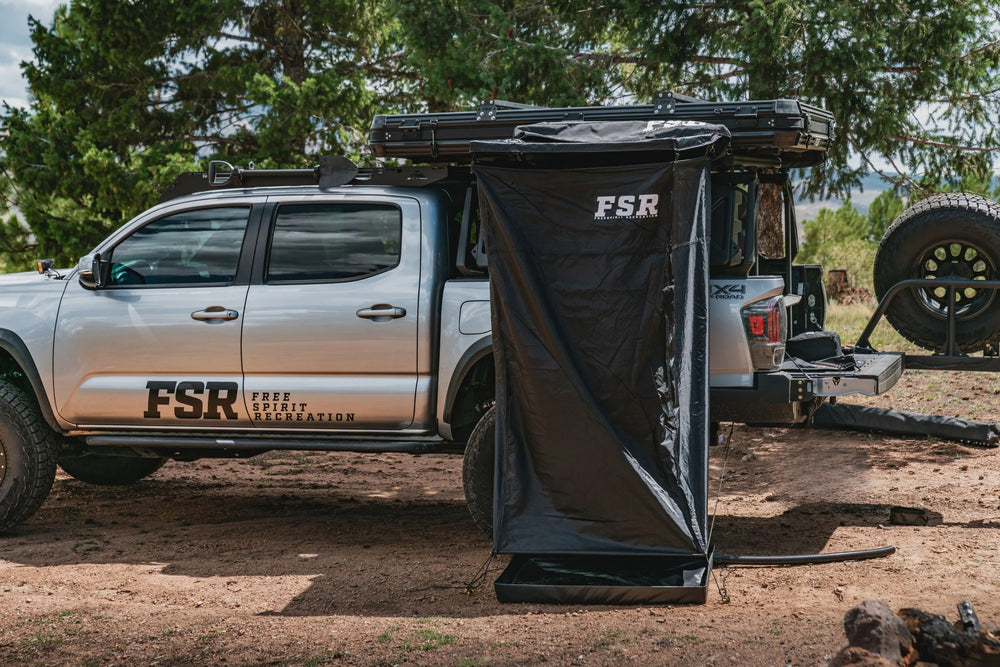 Shower Awning mounted on the side of a Tacoma