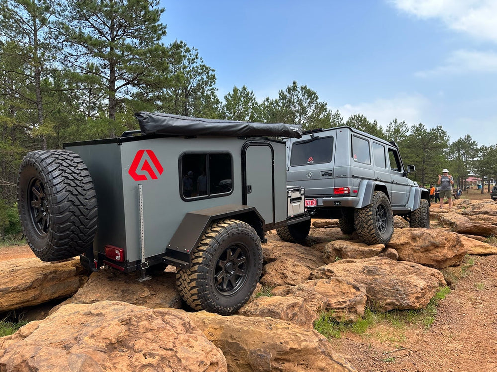Venturist trailer carwning on rock with G-Wagon