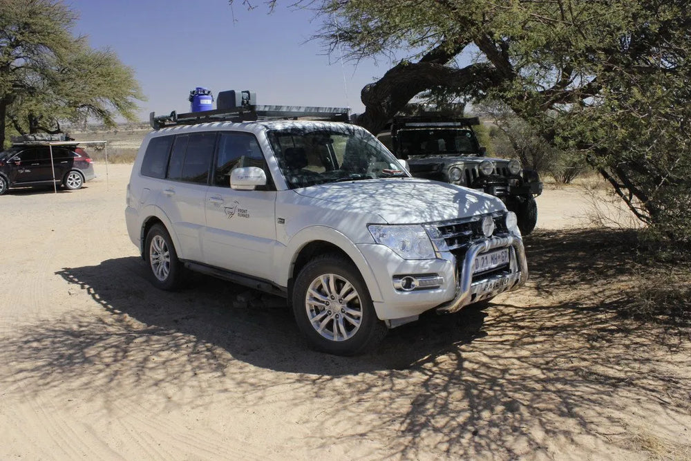 White Montero with Front Runner rack in dessert shot from side