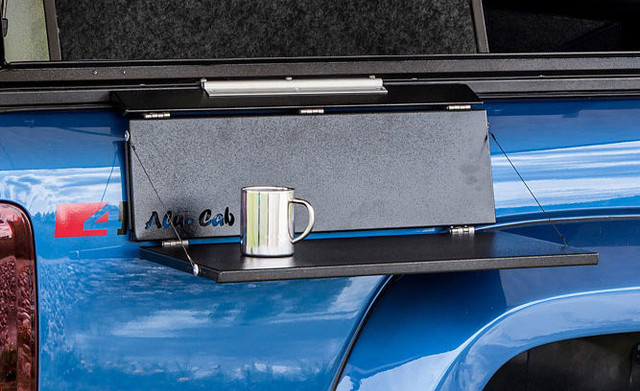 Alu-Cab Side Slide Prep Table With a Mug On It