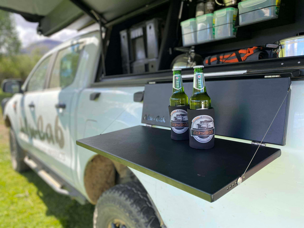 Alu-Cab Side Slide Prep Table With Beer Bottles On It