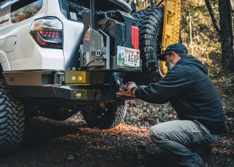 Person Attaching An Accessory To The Backwoods 5h Gen 4Runner Rear Bumper