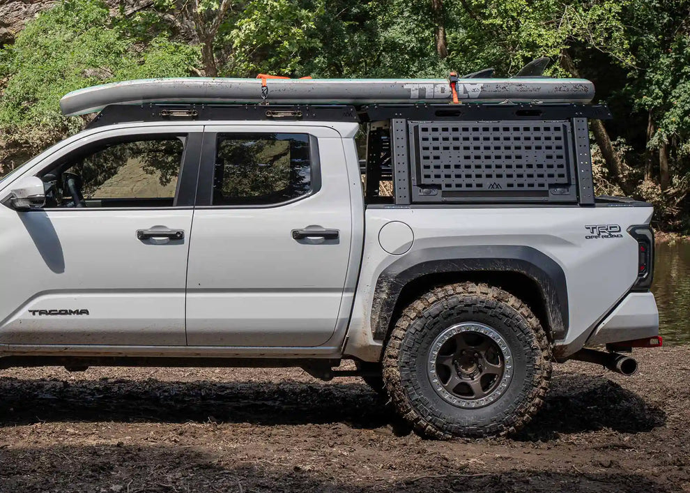 Backwoods Tacoma Overland Bed Rack in use hauling camping gear