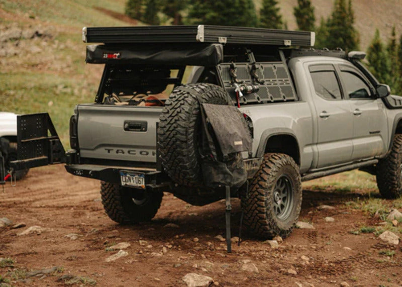 Backwoods 3rd Gen Tacoma Dual Swing Out Rear Bumper Side View With Opened Doors And A Tire Attached To It