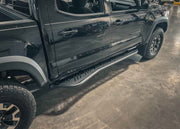 Rock Sliders included in the Backwoods Adventure Mods Tacoma Ultimate Off Road Kit installed on a 3rd Gen Toyota Tacoma