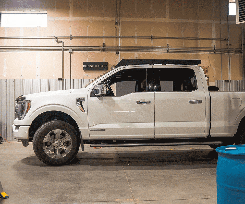 Ford F150 Prinsu Pro roof rack rear angle showing aerodynamic wind deflector