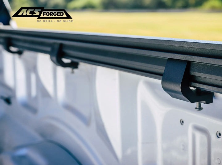 supporting rails of the leitner acs forged no drill bed rack ford f150