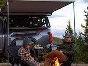 Front Runner Toyota Tundra Pro Bed Rack Installed With People Sitting Under The Mounted Awning