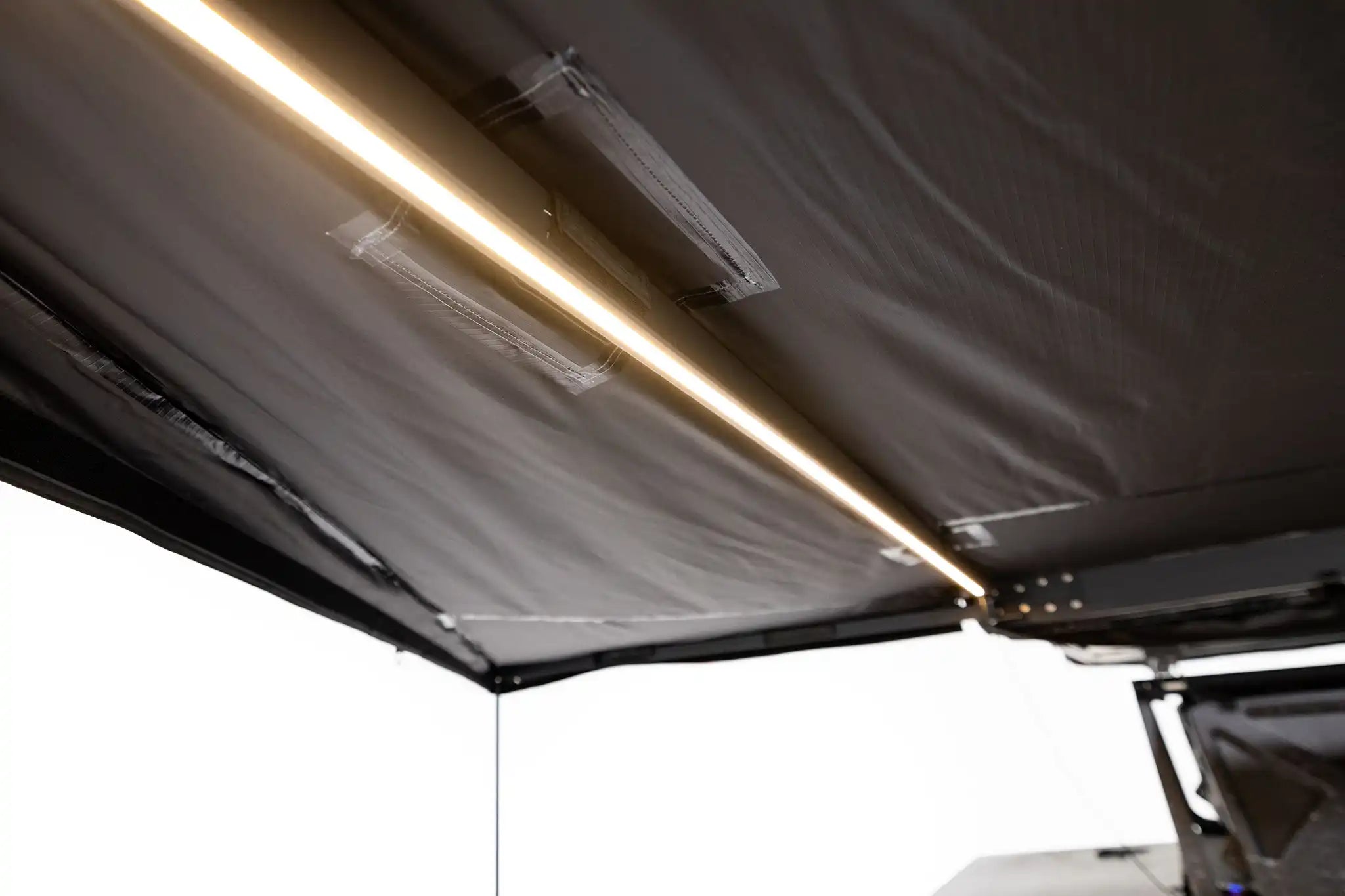 FSR 180 Awning V2 integrated dual color dimmable LED lighting illuminating the covered camp area