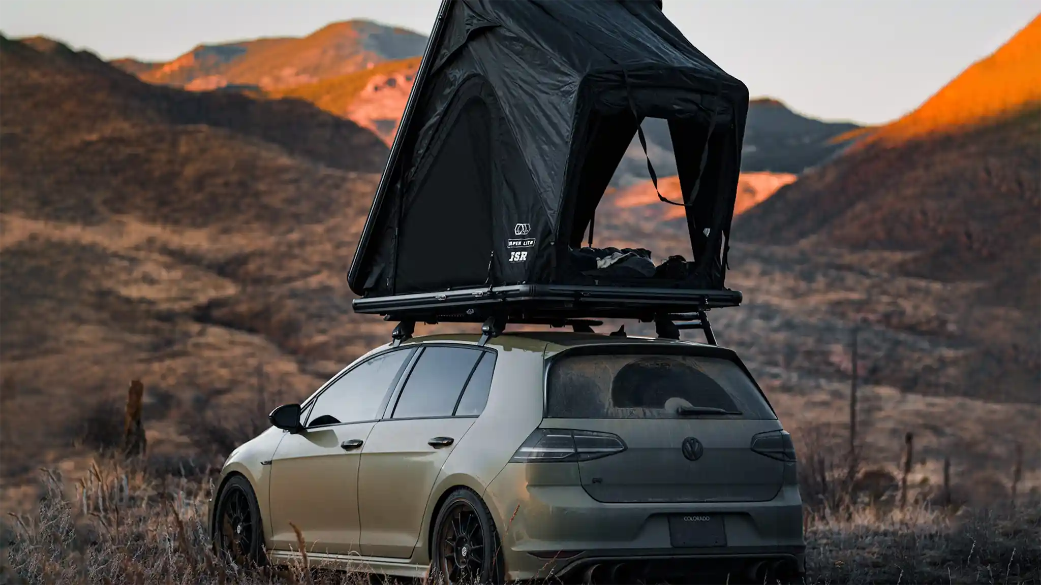 FSR Aspen Lite rooftop tent installed on a compact car showing ultralight clamshell profile