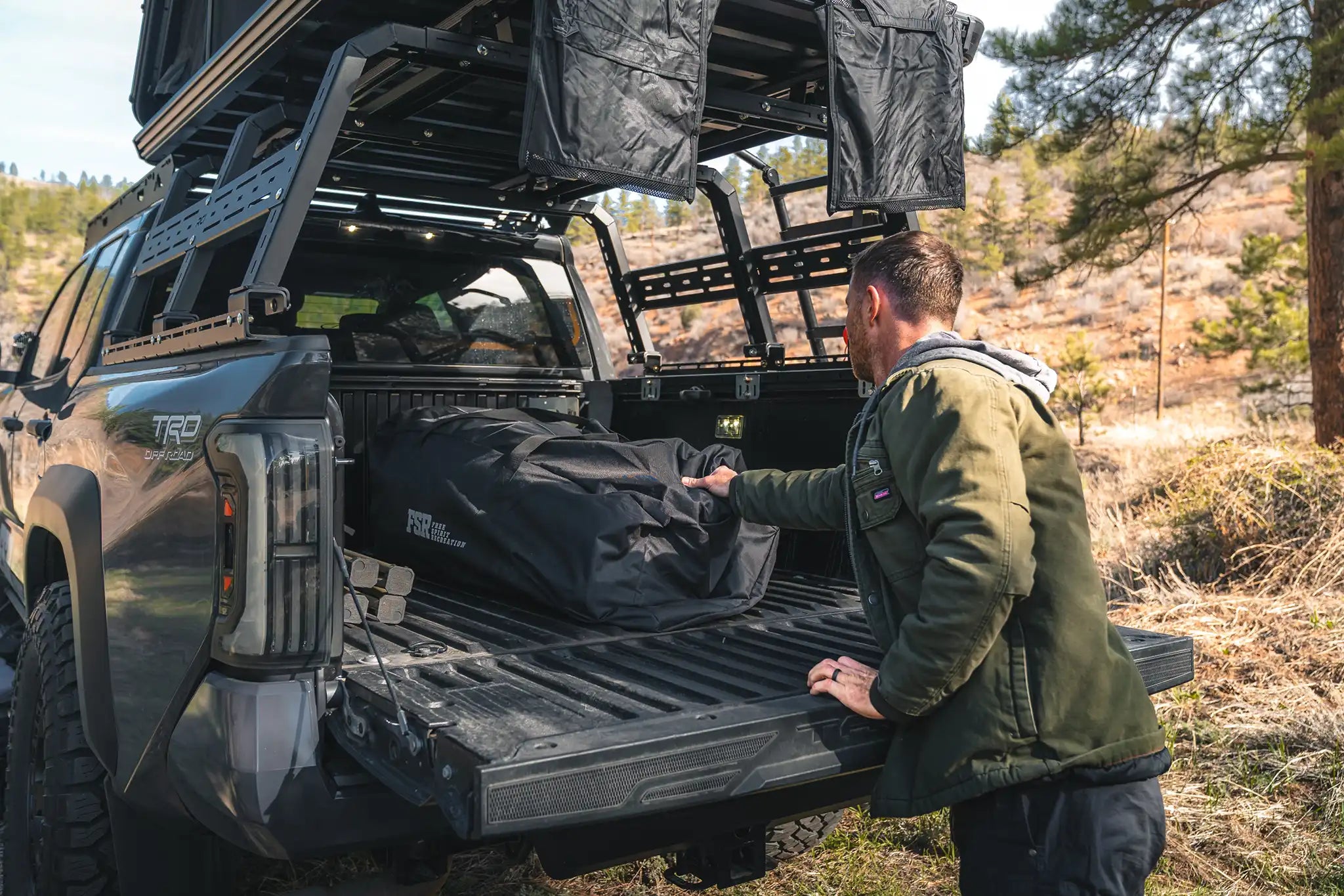 FSR Hub 4 Double packed into its 54 inch carry bag shown in a truck bed for transport