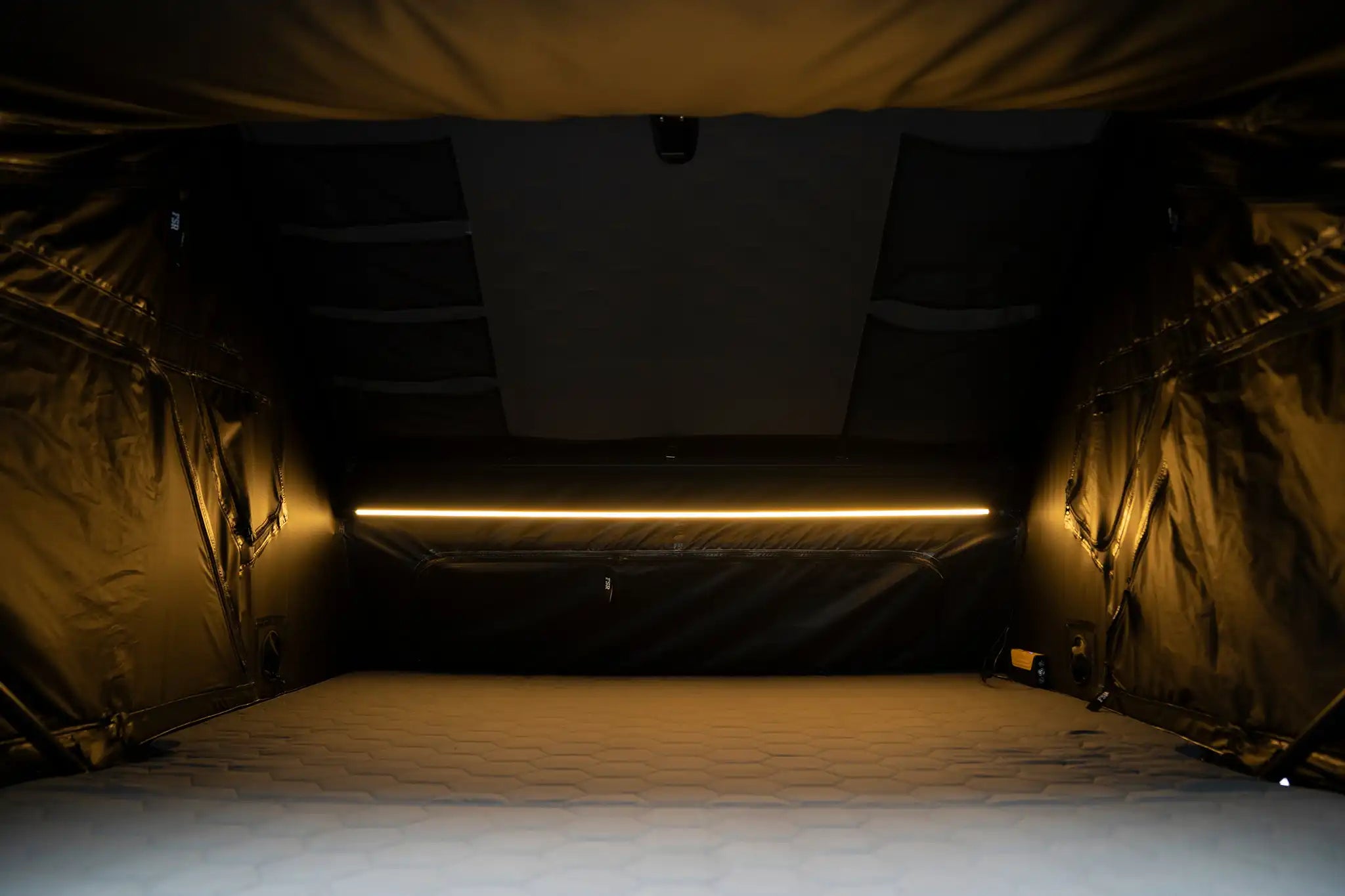 FSR Kali King rooftop tent interior showing integrated dimmable LED lighting and memory foam mattress