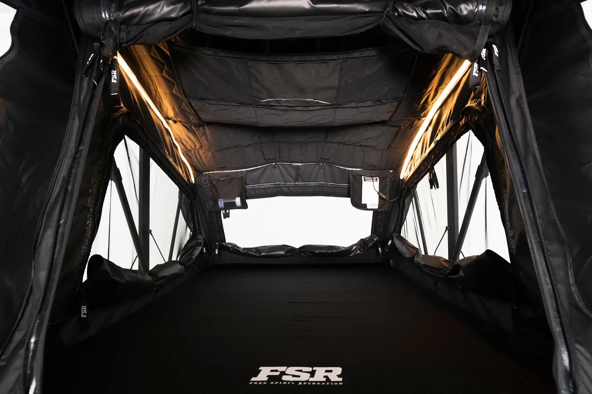 FSR Nova Standard rooftop tent interior showing integrated dimmable LED lighting and storage pockets