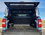 Back View Of The GAIA Campers Ford Maverick Truck Cap With The Open Door