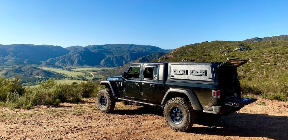 Installed GAIA Campers Jeep Gladiator Truck Cap With A Back Door Opened