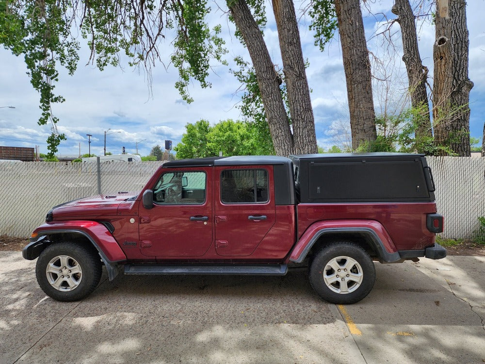 Side View Of The GAIA Campers Jeep Gladiator Truck Cap Installed On A Jeep