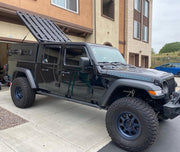GAIA Campers Jeep Gladiator Truck Cap With A Roof Rack Mounted