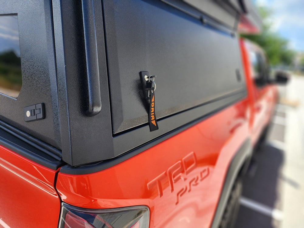 Close Up View Of The GAIA Campers Toyota Tacoma Camper Side Door Lock