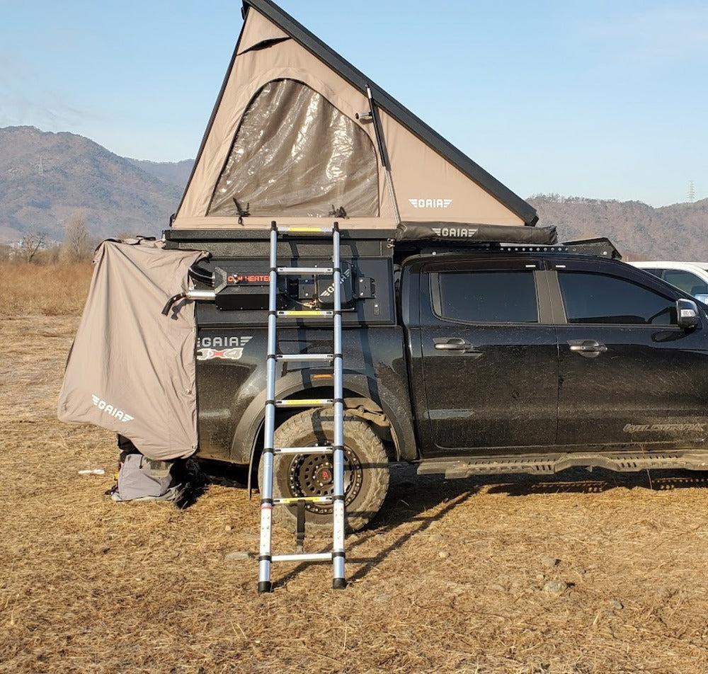 GAIA Campers Toyota Tacoma Camper With A Deployed Roof Top Tent And A Ladder